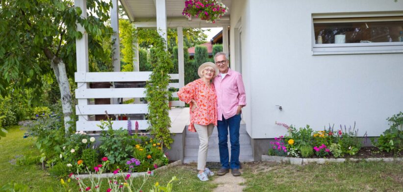 Elderly couple outside home. | Newsreel