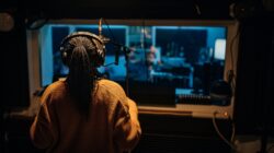 Singer in recording studio. | Newsreel