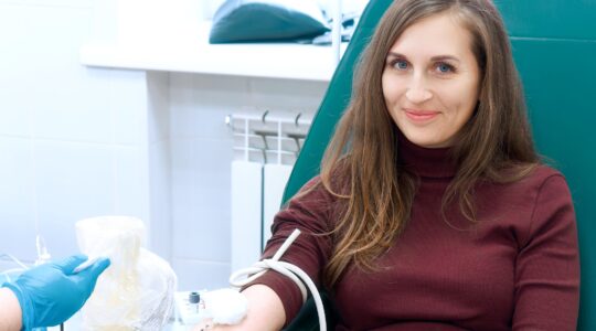 Person donating blood. | Newsreel