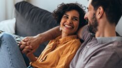 Happy couple on couch. | Newsreel