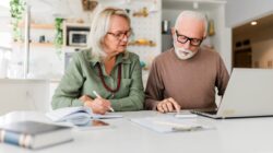 Elderly couple looking at finances. | Newsreel