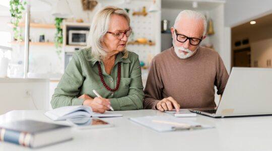 Elderly couple looking at finances. | Newsreel