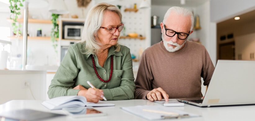 Elderly couple looking at finances. | Newsreel