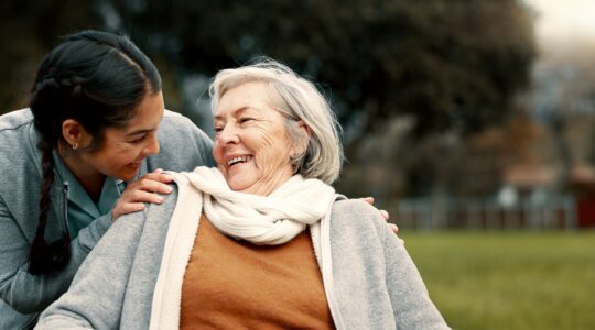 Aged care worker and client. | Newsreel