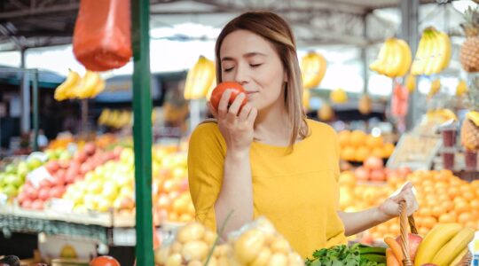 Woman smelling fresh food. | Newsreel