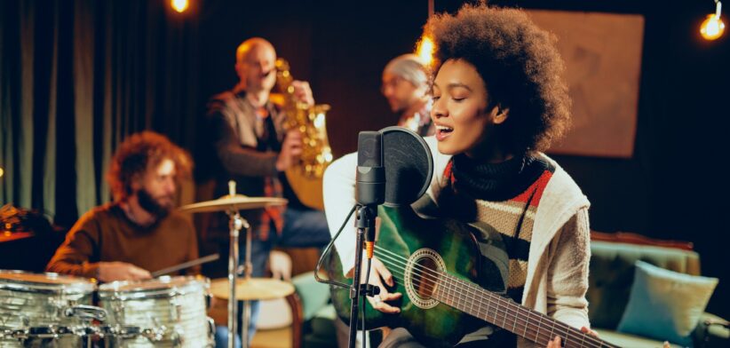 Musicians in a recording studio. | Newsreel