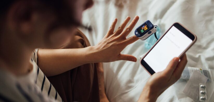 Person using oximeter. | Newsreel