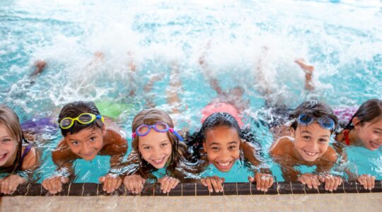 Children at a swimming lesson. | Newsreel