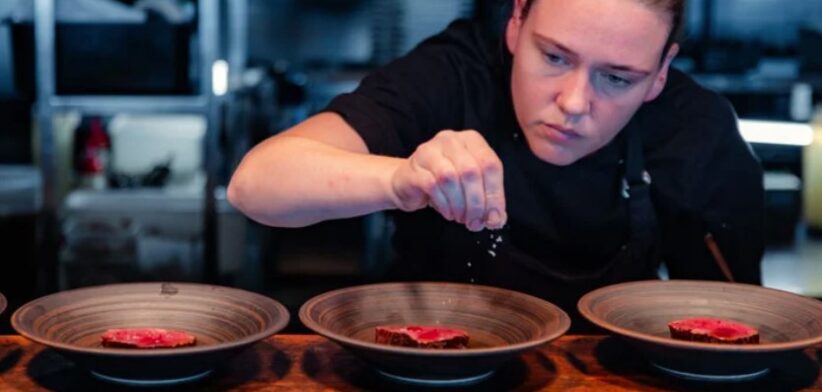 Chef working on restaurant dishes. | Newsreel