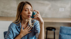 A young woman treating asthma symptoms - Newsreel