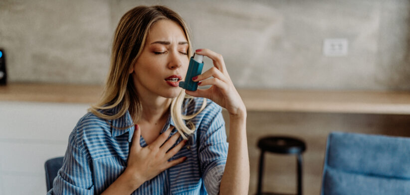 A young woman treating asthma symptoms - Newsreel