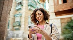 Woman using iPhone. | Newsreel