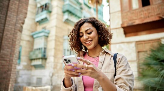 Woman using iPhone. | Newsreel