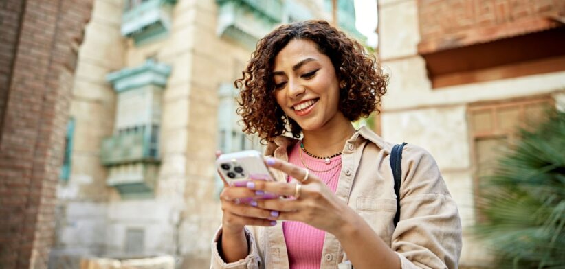 Woman using iPhone. | Newsreel