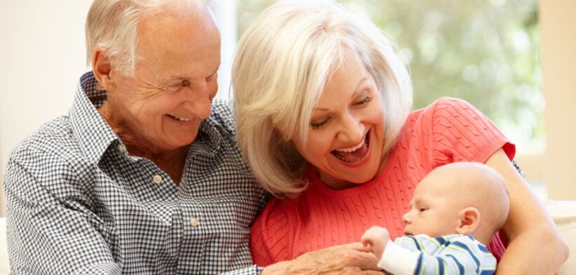 Elderly couple with baby. | Newsreel