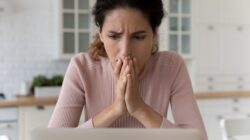 Woman worried looking at computer. | Newsreel