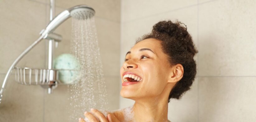 Woman having a shower. | Newsreel