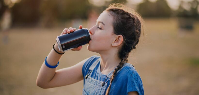 Girl drinking a soft drink. | Newsreel