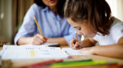 Child with a tutor. | Newsreel