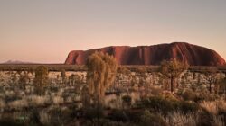 Uluru with Kata Tjuṯa in the background. | Newsreel