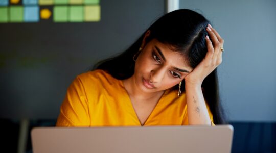 Woman worried at work. | Newsreel