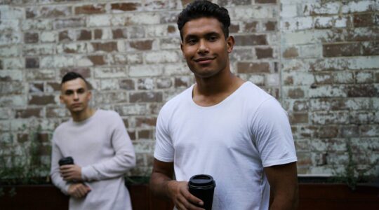 Aboriginal man drinking coffee. | Newsreel