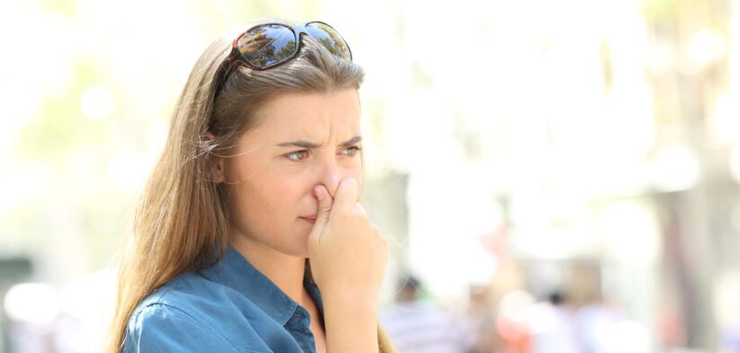 Woman holding her nose. | Newsreel