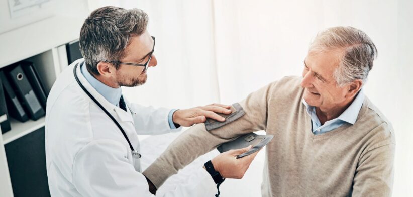 Man getting blood pressure taken. | Newsreel