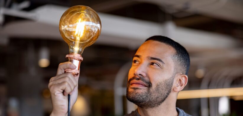 Man with light bulb. | Newsreel