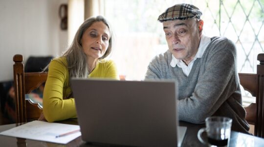 Elderly couple on computer. | Newsreel