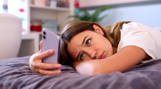 Teenager on mobile phone. | Newsreel