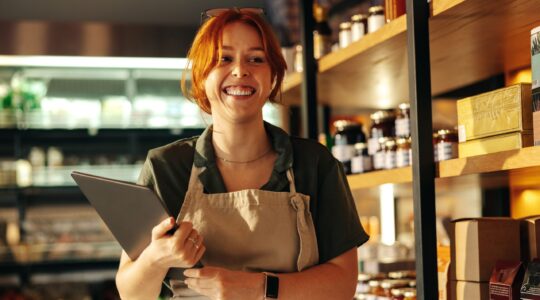 Female business owner in a store. | Newsreel