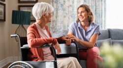 Care worker with elderly woman. | Newsreel