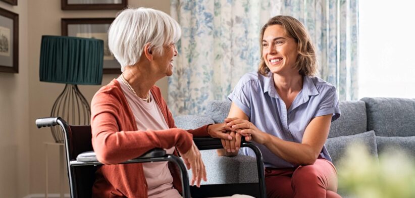 Care worker with elderly woman. | Newsreel