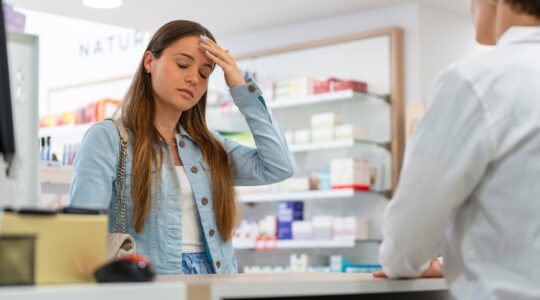 Sad woman at chemist. | Newsreel