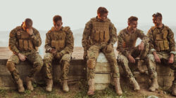 Soldiers squad relaxing after battle having a break on training