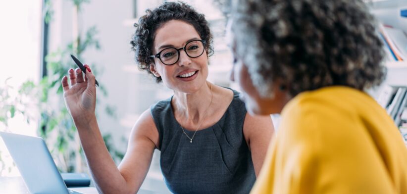 Woman providing advice to another woman.