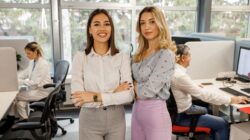 Two female officer workers in office. | Newsreel