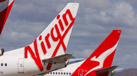 Virgin and Qantas plane tails. | Newsreel