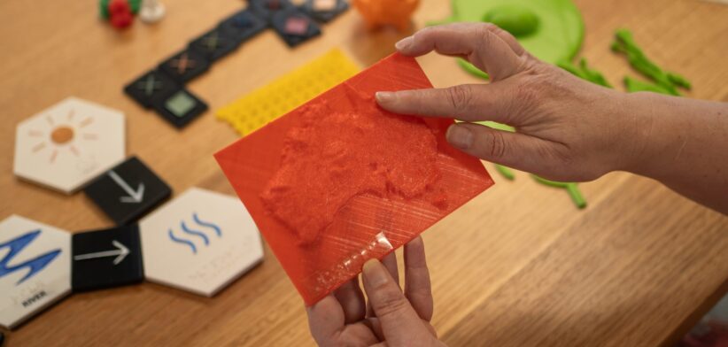 A model of Australia printed using the accessible guidelines including braille and raised contour lines.