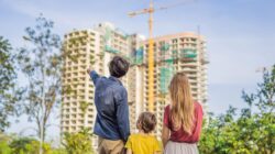 Family looking at apartment construction.