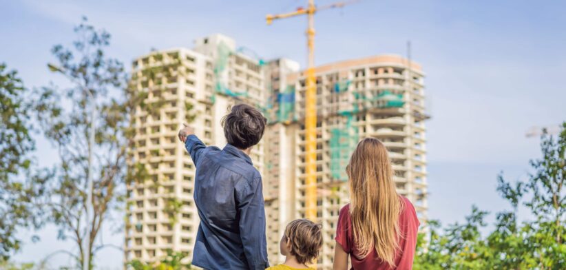 Family looking at apartment construction.