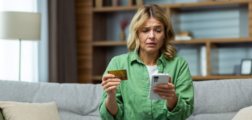 Woman worried about phone transaction.