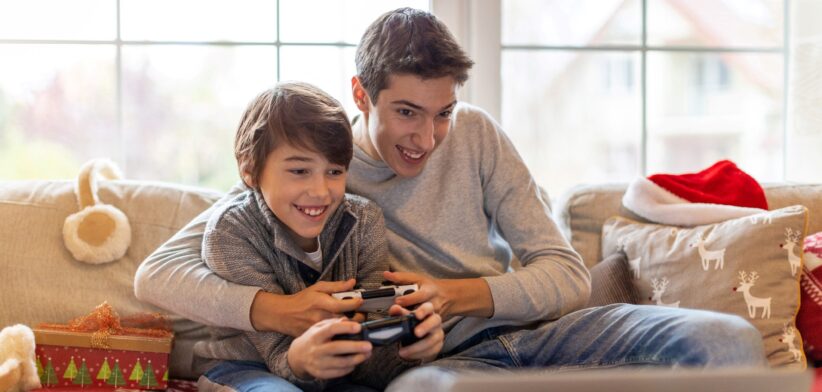 Two young brothers playing video games. | Newsreel