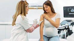 Pregnant woman receiving an injection. | Newsreel