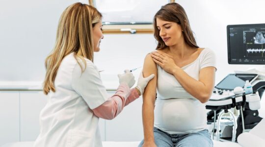 Pregnant woman receiving an injection. | Newsreel