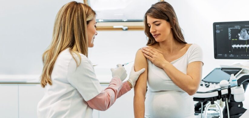 Pregnant woman receiving an injection. | Newsreel