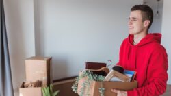 Young man moving in to home. | Newsreel