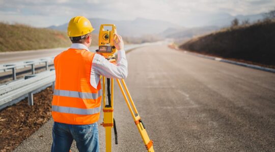 Surveyor on road. | Newsreel