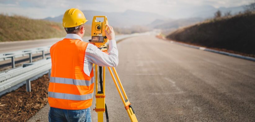 Surveyor on road. | Newsreel